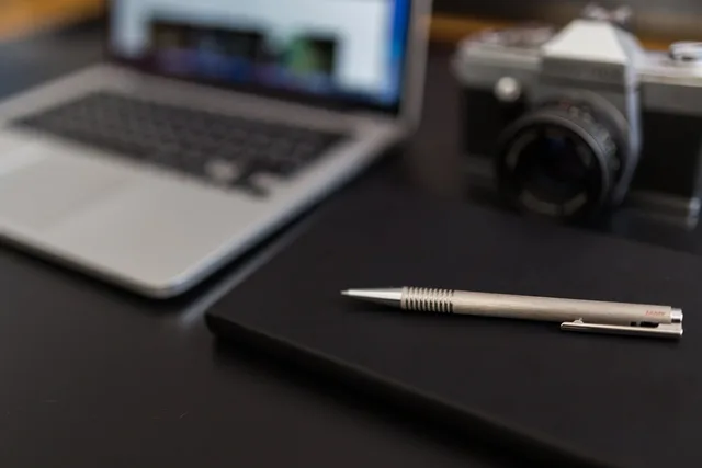 notebook, pen, macbook, laptop, computer, camera, dslr, technology, creative, office, desk, working, business, gray business, gray computer, gray office, gray technology, gray laptop, gray work, gray camera, gray desk, gray creative. Which creative advertising jobs can go to AI, and which decisions must stay with a person